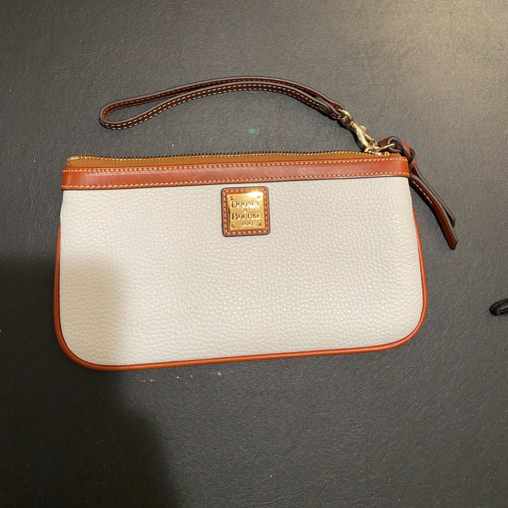 Dooney and Burke Wristlet classic cream color. Perfect for all occasions!